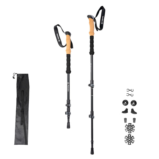 Two hiking poles with black and cork handles on a white background