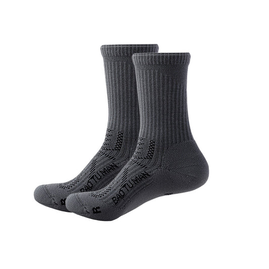 Dark gray Merino wool hiking socks with full-foot cushioning, arch support, and crew-height cuffs.