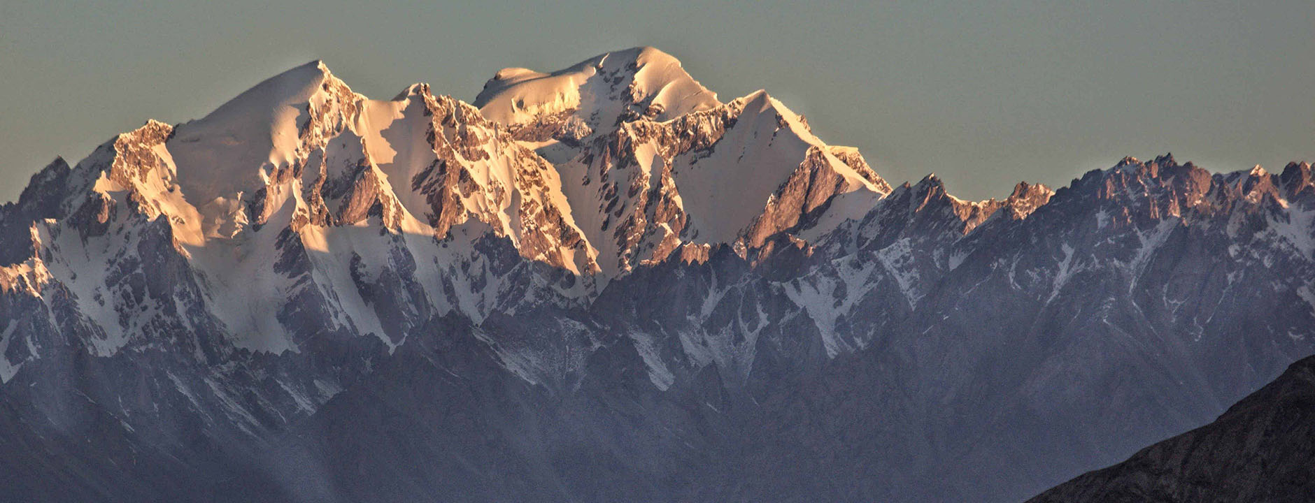 Snow-capped mountain range with a clear sky
