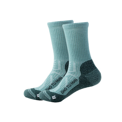 Green Merino wool hiking socks with dark green reinforced heels and toes and breathable knit panels.