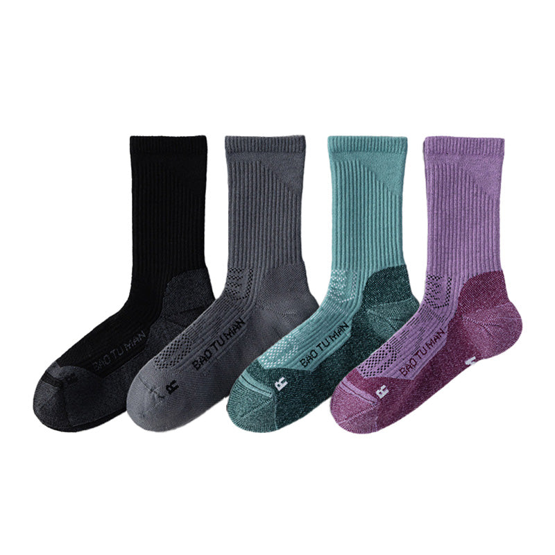 Merino wool hiking socks displayed in black, dark gray, green, and purple color options.